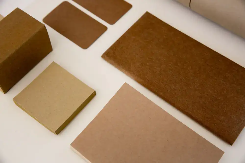 A neat stack of padded eco-friendly mailers and paper bags