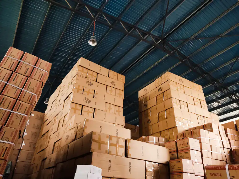 Sustainable packaging boxes stacked in a supply facility